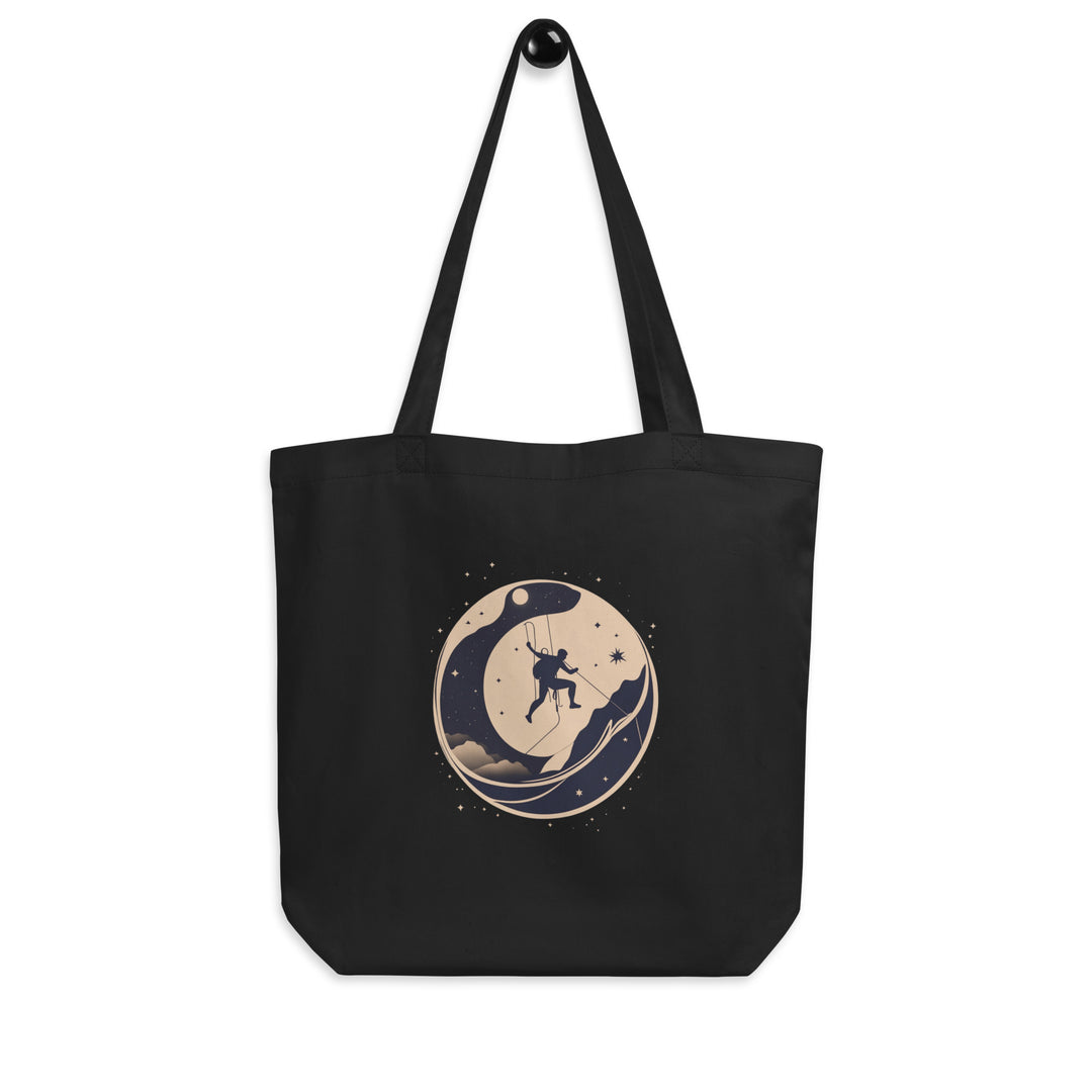 Black tote bag picturing a climber traversing a wall